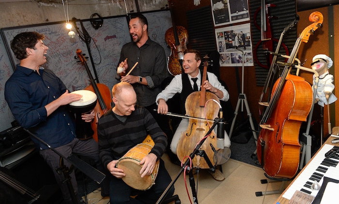 (Francisco Kjolseth | The Salt Lake Tribune) Always having fun, The Piano Guys gather in their home studio in Sandy recently as they get ready for an upcoming show. Clockwise from left, videographer Paul Anderson, music producer Al van der Beek, cellist Steven Sharp Nelson and pianist Jon Schmidt maintain a close bond and are always quick with a tease or a joke while making music.