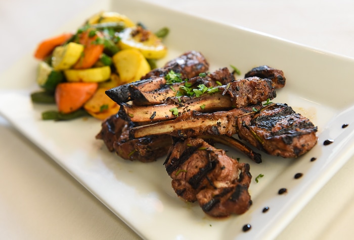 (Francisco Kjolseth | The Salt Lake Tribune) Grilled rosemary lamb chops with roasted vegetables from Per Noi Trattoria, a popular Italian restaurant in Salt Lake City, that just opened a second location at 8657 S. Highland Drive in Sandy.