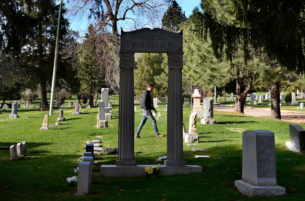 (Scott Sommerdorf | The Salt Lake Tribune) City Councilman Chris Wharton, who represents the area around the Salt Lake City Cemetery, walks in one of the older areas, Friday, April 13, 2018. Wharton is involved in an effort to help get more funding for the renewal of the cemetery.