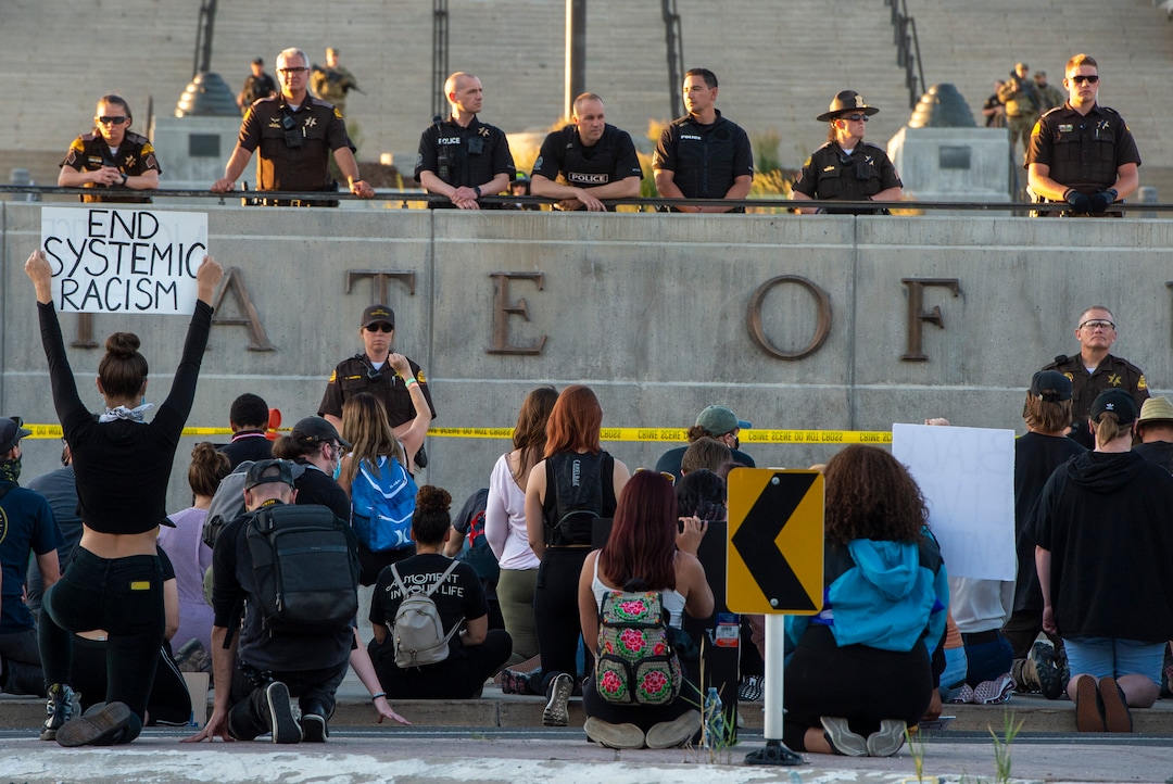 (Rick Egan  |  The Salt Lake Tribune) Protesters kneel down in silence for 9 minutes in remembrance of George Floyd as they gather at the State Capitol for a demonstration, Wednesday, June 3, 2020.