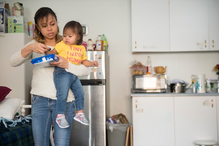 (Jeremy Harmon  |  The Salt Lake Tribune) Vicky Chavez gets a cookie for her daughter Bella in their room at the First Unitarian Church on 1300 East in Salt Lake City on Dec. 14, 2018.