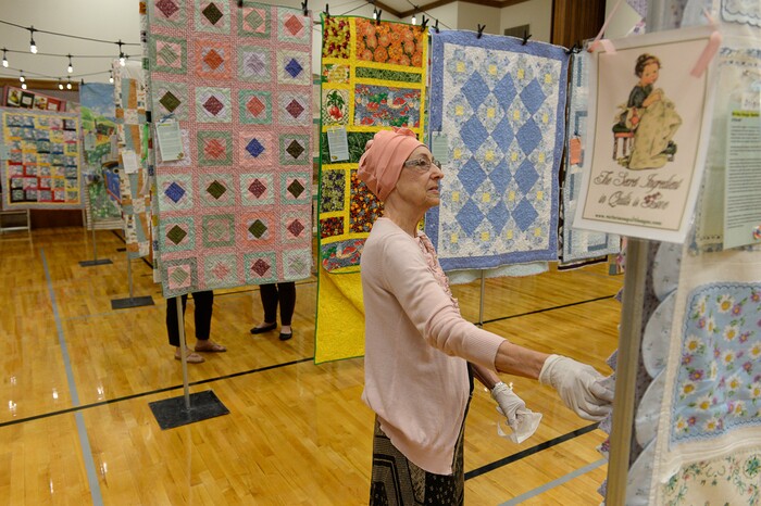 (Francisco Kjolseth  |  The Salt Lake Tribune)  Nacele Hart overlooks her more than 100 quilts and numerous sewing projects created over a 10-year period for her children, grandchildren and great-grandchildren. On Friday at a church in Orem her family put them on display with plans to hand them out Saturday to her loved ones. She's also currently battling cancer.