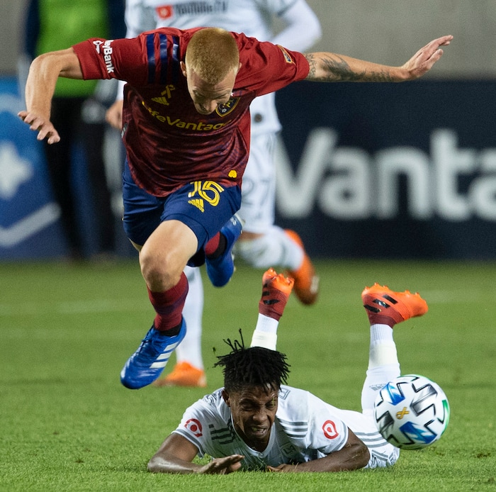 (Rick Egan  |  The Salt Lake Tribune).  Real Salt Lake defender Justen Glad (15) picks up a yellowfins card as he collides with Los Angeles FC forward Latif Blessing (7), in MLS soccer action between Real Salt Lake and Los Angeles FC at Rio Tinto Stadium, on Wednesday, Sept. 9, 2020.


