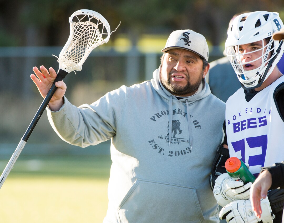 (Rick Egan | The Salt Lake Tribune) Box Elder lacrosse coach Juan Gaytan talks to player Logan Clark during a tournament in Logan on Saturday, Nov. 3, 2018.