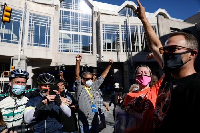 People celebrate outside the Pennsylvania Convention Center after Democrat Joe Biden defeated President Donald Trump to become 46th president of the United States, Saturday, Nov. 7, 2020, in Philadelphia. (AP Photo/Rebecca Blackwell)