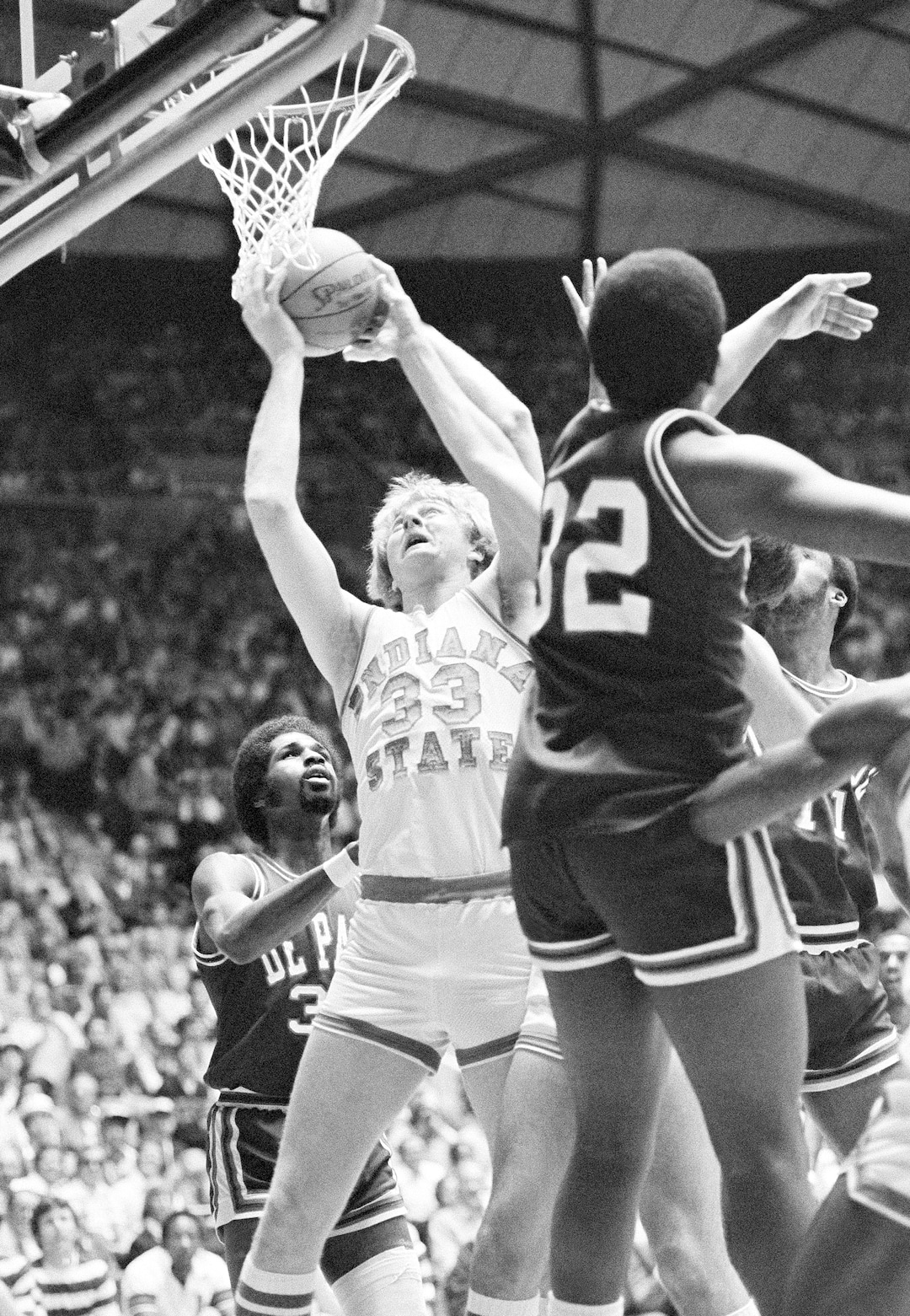 (AP Photo) Indiana State University's Larry Bird goes up for two points in the opening minutes of his team's game against DePaul in the semi-finals of the NCAA Championships Saturday, March 24, 1979. DePaul players are Curtis Watkins (30) and Mark Aguirre (32). 