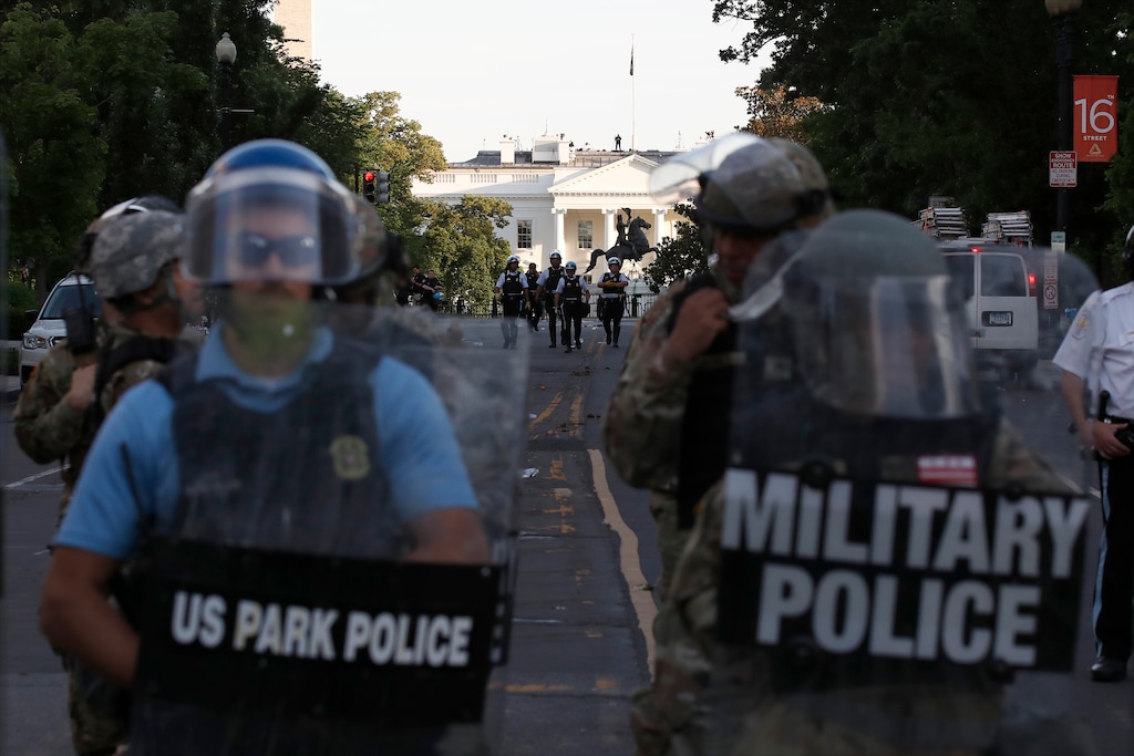Police clear the area around Lafayette Park and the White House as demonstrators gather to protest the death of George Floyd, Monday, June 1, 2020, in Washington. Floyd died after being restrained by Minneapolis police officers. (AP Photo/Alex Brandon)