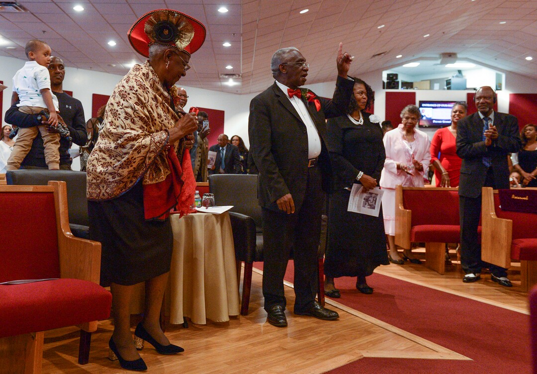 (Leah Hogsten  |  The Salt Lake Tribune) The Rev. France A. Davis and his wife Willene, celebrated Davis' 44th anniversary as pastor at Calvary Baptist Church. The two are greeted and congratulated by members of the congregation, Sunday, April 22, 2018, as they enter the nave. Davis, who arrived in Salt Lake City in 1974, has built the African-American congregation to more than 700 members. 