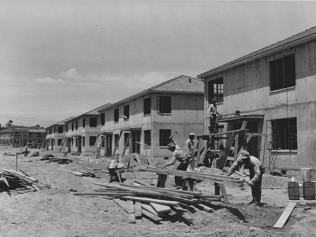 Houses under construction in an undated photo at the Navy defense housing project for enlisted men in the Marines and Navy in San Diego, Calif. In a housing crisis that has now stretched across two decades, Americans have spent years arguing about the local regulations governing what and where people can build. (Russell Lee/Farm Security Administration, via The New York Public Library/The New York Times)