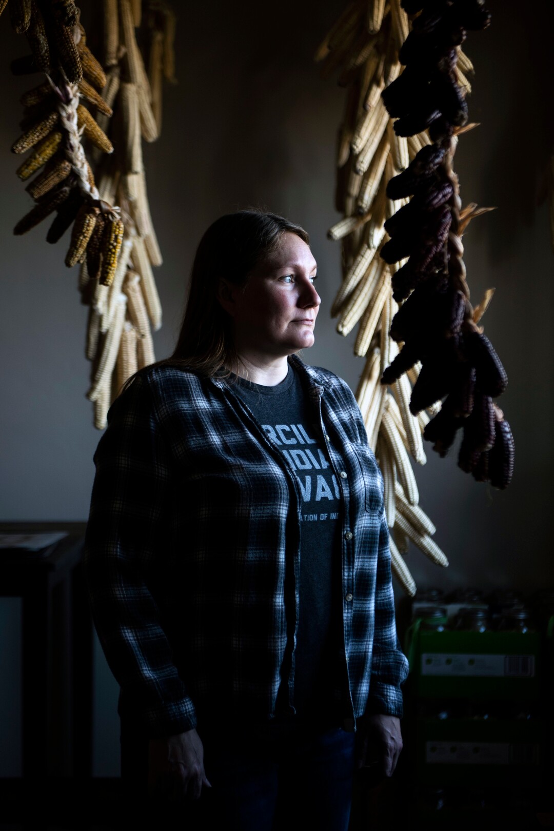 Rebecca Webster in the basement of her home in De Pere, Wisc., on April 4, 2020. Webster and her husband, Stephen, have been growing white corn on the Oneida Nation of Wisconsin’s reservation to supply families in need. (Lauren Justice/The New York Times)