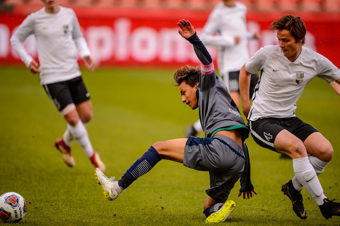 (Trent Nelson  |  The Salt Lake Tribune)  Copper Hills's Gianmarko "Marko" Robles and Weber's Kolton Obray as Weber faces Copper Hills High School in the 6A boys state championship game at Rio Tinto Stadium in Sandy, Thursday May 23, 2019.