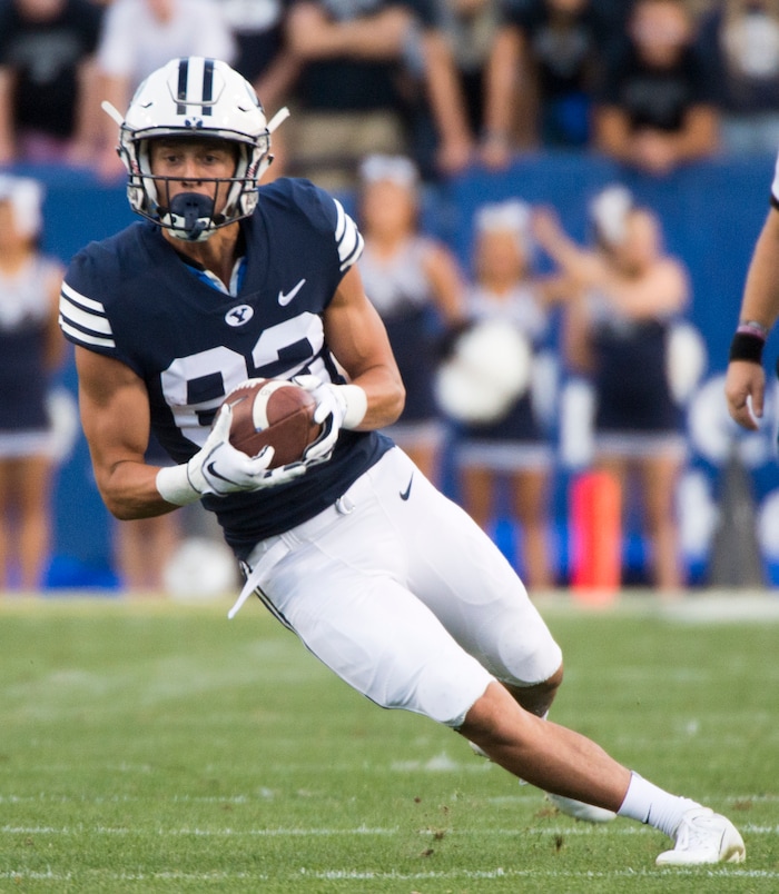 (Rick Egan  |  The Salt Lake Tribune)    Brigham Young wide receiver Dax Milne (82) runs the ball for the Cougars, in football action Brigham Young Cougars vs McNeese State Cowboys at Lavell Edwards Stadium, Saturday, Sept. 22, 2018.


