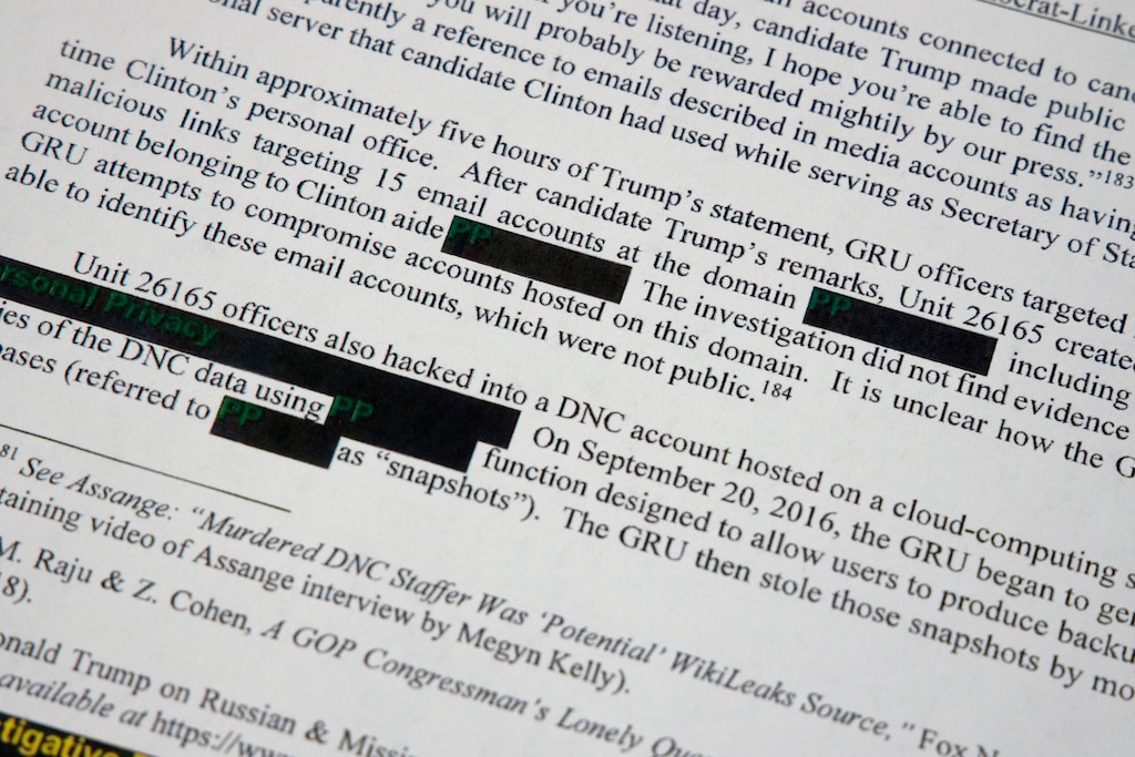 Special counsel Robert Mueller's redacted report on the investigation into Russian interference in the 2016 presidential election is photographed Thursday, April 18, 2019, in Washington.  (AP Photo/Jon Elswick)