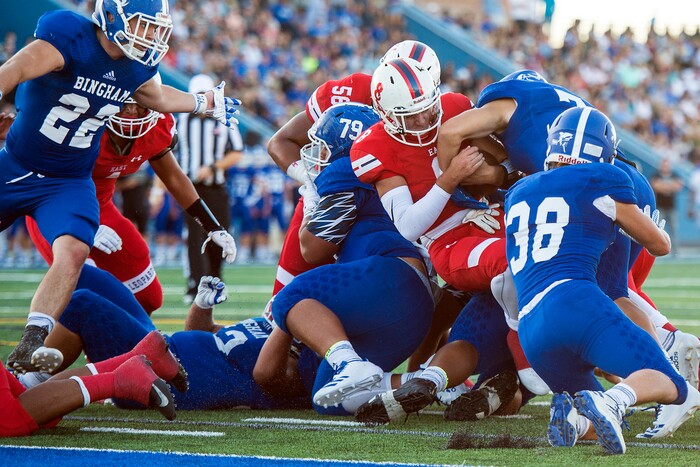 (Chris Detrick  |  The Salt Lake Tribune)  Bingham's Brayden Cosper (7) stops East's Ben Ford (8) during the game at Bingham High School Friday, August 25, 2017. Bingham is winning the game 24-17 at halftime. 