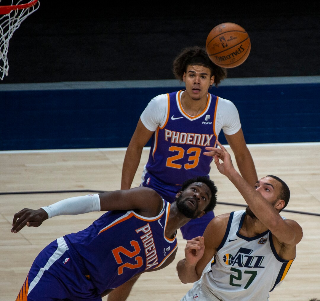 (Rick Egan | The Salt Lake Tribune)Utah Jazz center Rudy Gobert (27) is fouled by Phoenix Suns center Deandre Ayton (22), in preseason NBA action between Utah Jazz and Phoenix Suns at Vivint SmartHome Area, on Saturday, Dec. 12, 2020.
