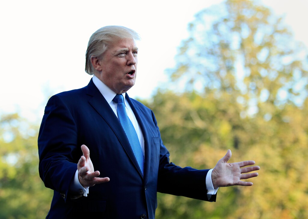 (Manuel Balce Ceneta) | The Associated Press) President Donald Trump speaks to reporters upon his return to the White House in Washington, Sunday, Sept. 24, 2017. Citizens of eight countries will face new restrictions on entry to the U.S. under a proclamation signed by Trump on Sunday.