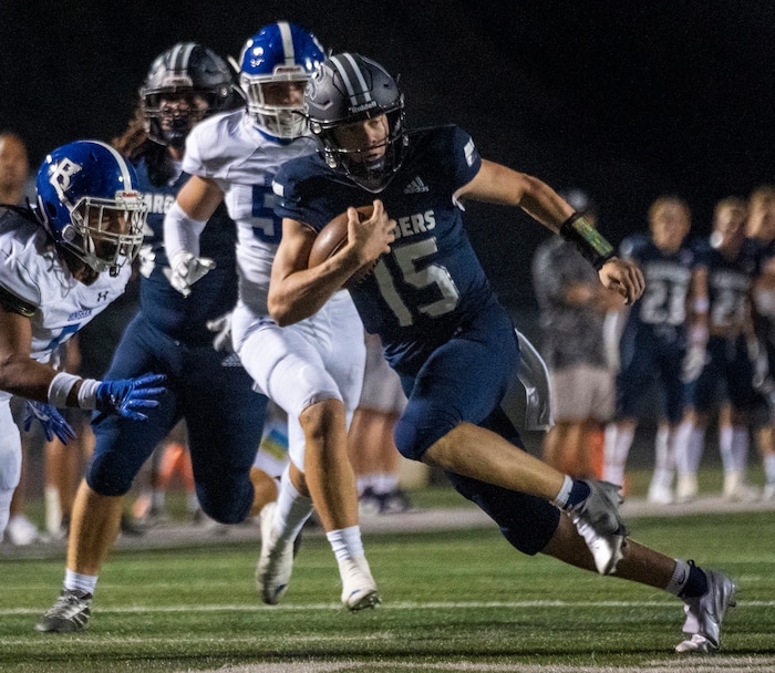 (Rick Egan | The Salt Lake Tribune) Corner Canyon quarterback Devin Brown (15), runs the ball for the Chargers, in  prep football action between the Corner Canyon Chargers and the Bingham Miners, on Friday, Aug. 27, 2021.