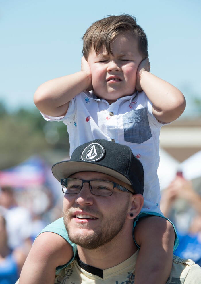 (Rick Egan  |  The Salt Lake Tribune)   Jesse Balls of Layton, holds his son Brixton, 3 on his shoulders to get a better look as the F-35A jets fly overhead, during the Warriors Over the Wasatch airshow at Hill Airforce Base, Sunday, June 24, 2018.