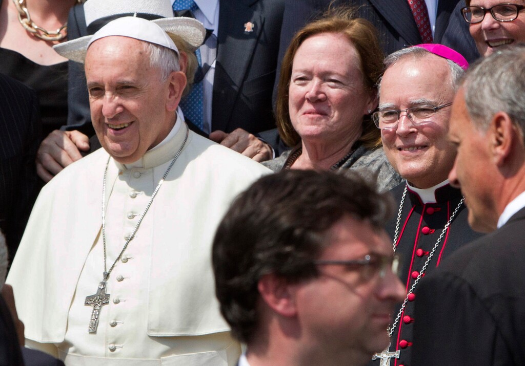 (AP Photo/Riccardo De Luca) In this June 24, 2015, file photo, Philadelphia's Archbishop Charles Chaput, right, stands next to Pope Francis as they pose for a photo with a delegation from Philadelphia at the end of the pontiff's weekly general audience in St. Peter's Square at the Vatican. Pope Francis traveled to Philadelphia in September to attend the World Meeting of Families. Chaput, the meeting's host, moved to limit lesbian, gay, bisexual and transgender Roman Catholics as they tried to lobby for a broader role in the event.