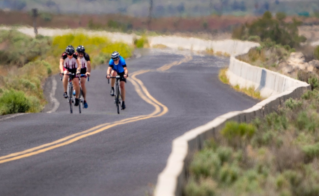 (Francisco Kjolseth | The Salt Lake Tribune) As the mercury rises, heat waves obscure cyclists along the North Temple frontage road near the Great Salt Lake on Thursday, May 26, 2022.