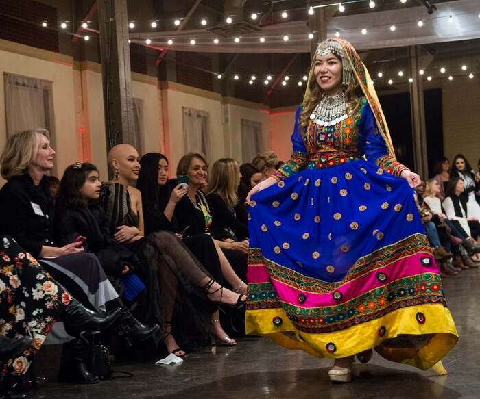 (Rick Egan  |  The Salt Lake Tribune)   Golshan from Afghanistan walks the runway during the 8th Annual Women of the World Fashion Show. The fashion show fund is raiser for the non-profit that seeks to help refugees settle in a new culture. Wednesday, March 7, 2018.