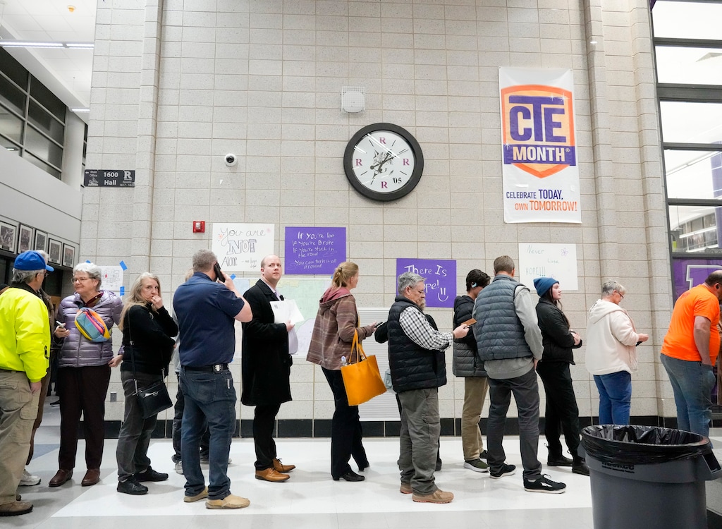 (Bethany Baker  |  The Salt Lake Tribune) Caucusgoers line up during the presidential primary caucuses at Riverton High School in Riverton on Tuesday, March 5, 2024.