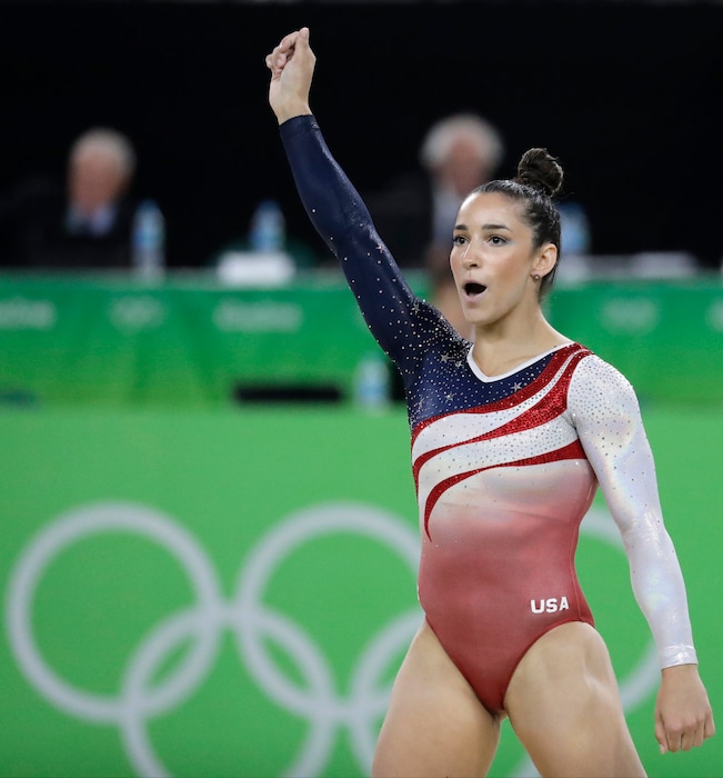 United States' Aly Raisman celebrates after her performance on the floor during the artistic gymnastics women's team final at the 2016 Summer Olympics in Rio de Janeiro, Brazil, Tuesday, Aug. 9, 2016. (AP Photo/Charlie Riedel)