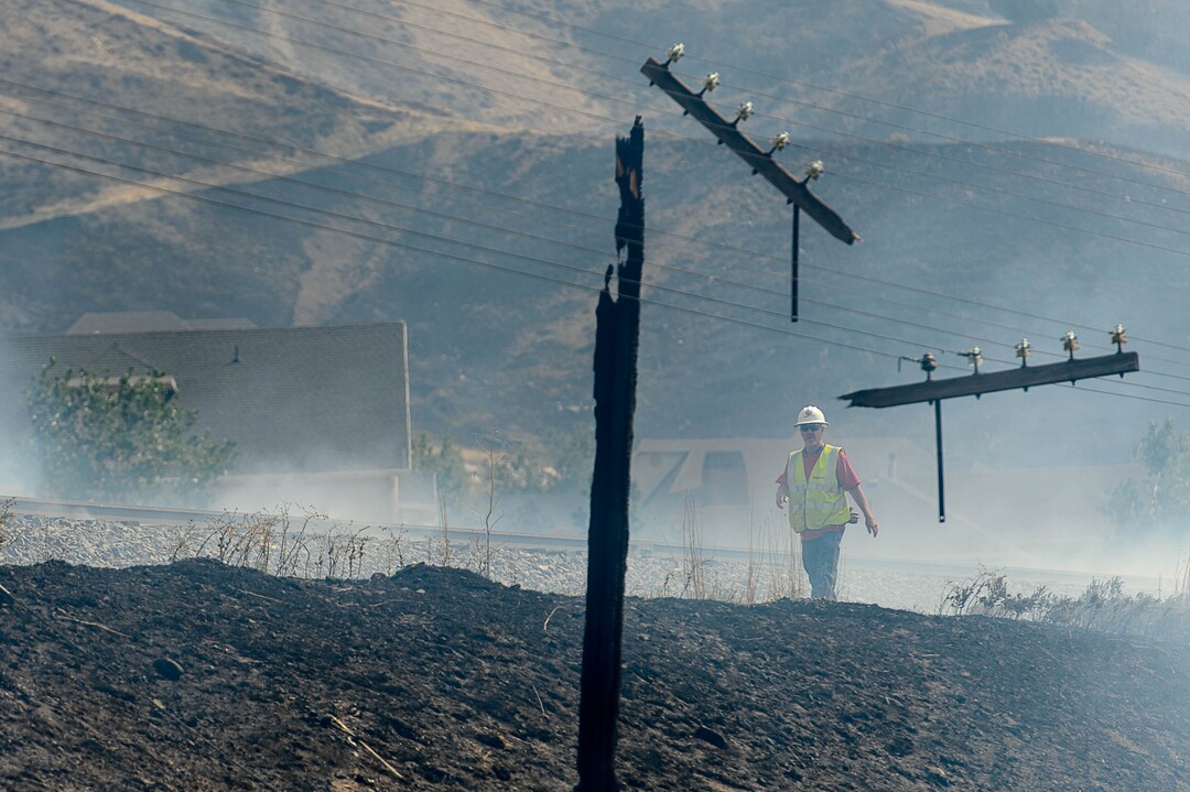 (Trent Nelson | The Salt Lake Tribune)  Power lines along the train tracks after a fire came through at the mouth of Weber Canyon, Tuesday September 5, 2017.