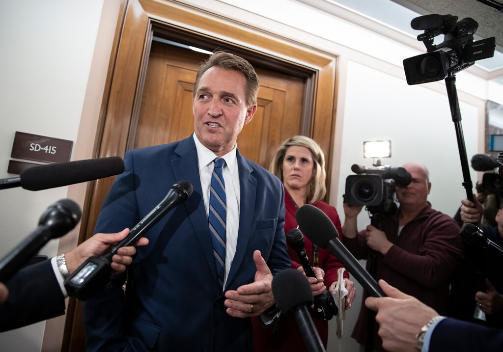 (File photo) In this Dec. 6, 2018, file photo, former Sen. Jeff Flake, R-Ariz., speaks with reporters on Capitol Hill in Washington. He has publicly endorsed Vice President Kamala Harris for president.