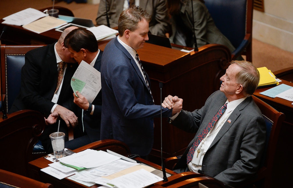 (Francisco Kjolseth | The Salt Lake Tribune) Sen. Allen Christensen, R-Ogden, right, sponsor of SB96, the replacement plan for the voter-approved full Medicaid expansion, is congratulated following debate on the floor as the Senate gave final approval to replacement plan on Monday, Feb. 4, 2019.