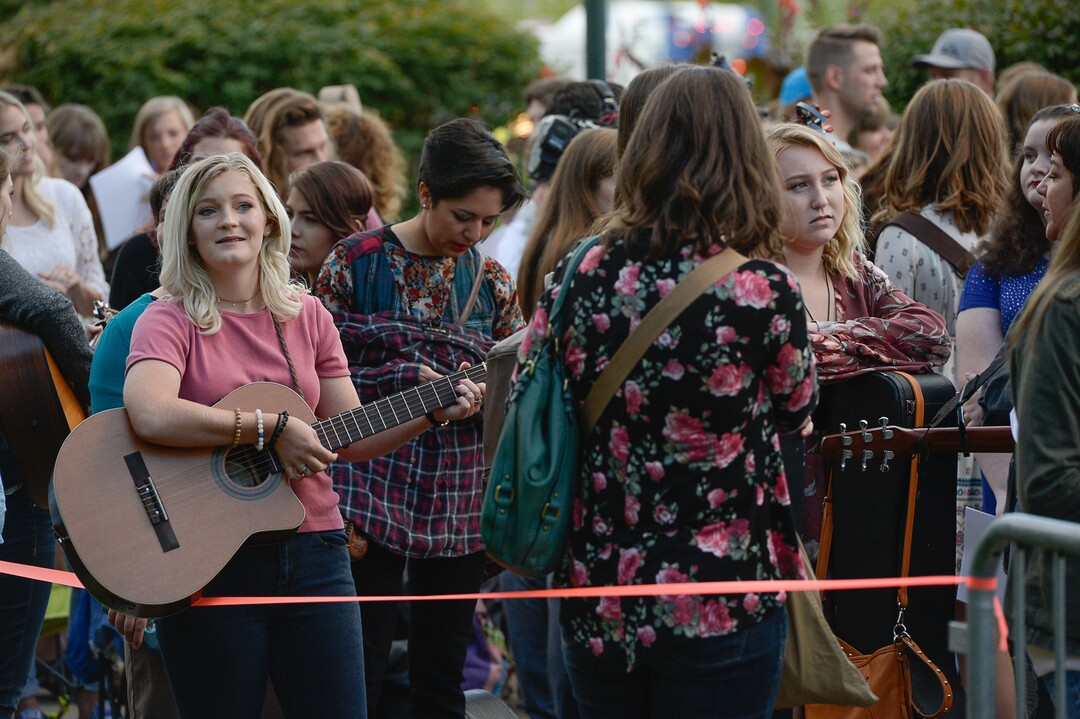 (Francisco Kjolseth  |  The Salt Lake Tribune)  Kyra Eisley of St. Johns, Arizona, warms up with her guitar along with other "American Idol" hopefuls prior to auditions in downtown Provo on Wednesday morning, Aug. 23, 2017, for the revived show, which is moving to ABC and will air in early 2018.