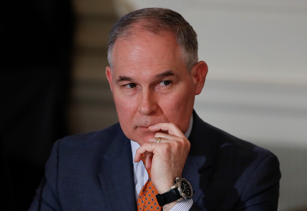 FILE - In this Feb. 12, 2018, file photo, Environmental Protection Agency Administrator Scott Pruitt attends a meeting with state and local officials in the State Dining Room of the White House in Washington. The Trump administration is rewriting Obama-era rules governing pollution from oil and gas operations and coal ash dumps, moves that opponents say will significantly weaken protections for human health and the environment. The EPA announced the changes Thursday, March 1, the latest in series of actions in the last year to roll back regulations opposed by the fossil-fuel industry. (AP Photo/Carolyn Kaster, File)