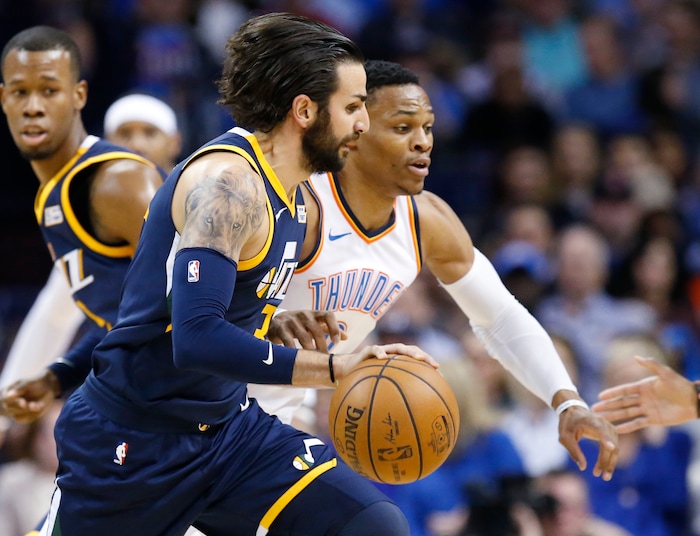Utah Jazz guard Ricky Rubio, left, drives around Oklahoma City Thunder guard Russell Westbrook during the first quarter of an NBA basketball game in Oklahoma City, Wednesday, Dec. 20, 2017. (AP Photo/Sue Ogrocki)
