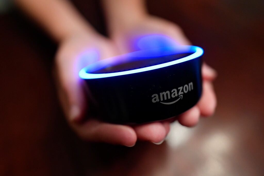 (AP Photo | Mike Stewart) In this Thursday, Aug. 16, 2018, photo a child holds his Amazon Echo Dot in Kennesaw, Ga.