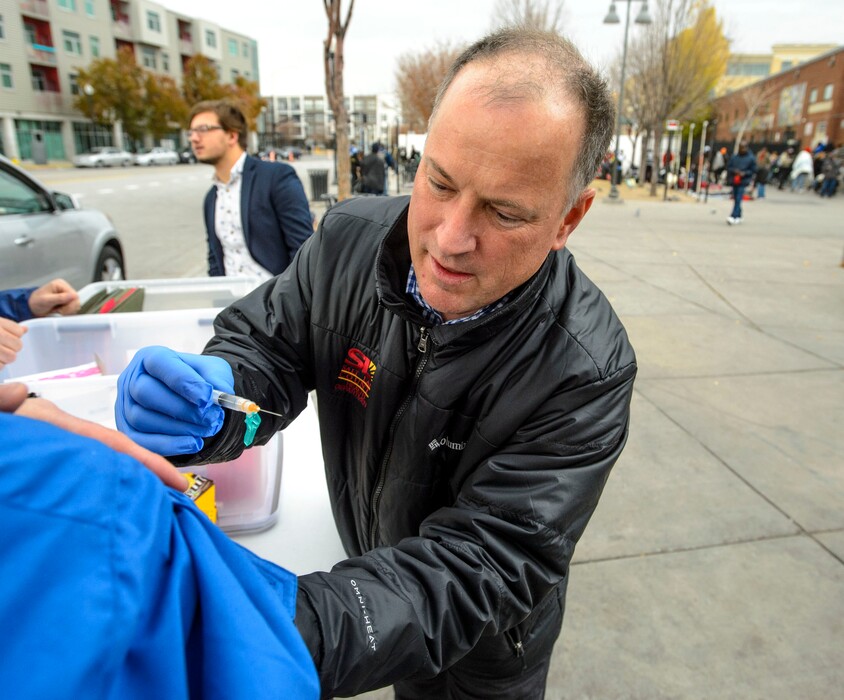 (Steve Griffin | The Salt Lake Tribune) Steven Beach, a registered nurse with the Salt Lake County Health Department, administers a hepatitis A vaccination at a mobile vaccination clinic setup outside at 500 West and 200 south in Salt Lake City Thursday November 16, 2017. The department is setting up the clinics to address the county's outbreak of hepatitis A. So far, 66 cases have been reported in Salt Lake County.