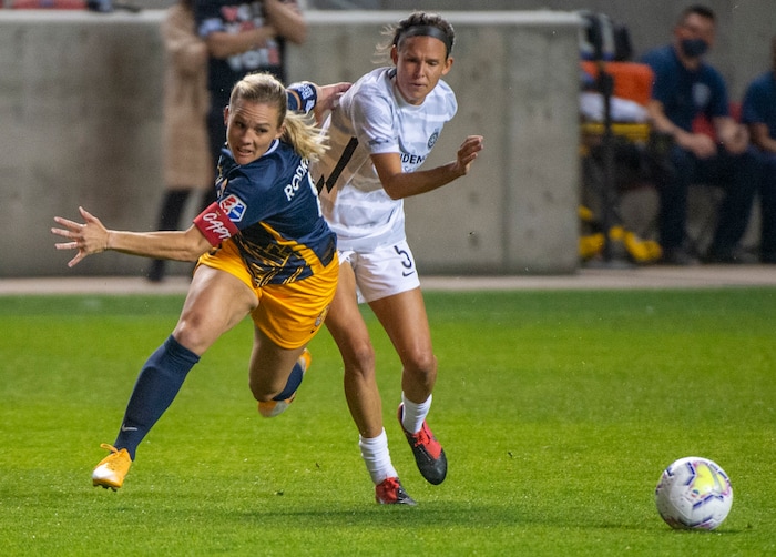 (Rick Egan | The Salt Lake Tribune) Utah Royals FC forward Amy Rodriguez (8) goes for the ball along with Portland Thorns FC defender Emily Menges (5), in soccer action between Utah Royals FC and Portland Thorns FC at Rio Tinto Stadium, on Saturday, Oct. 3, 2020.