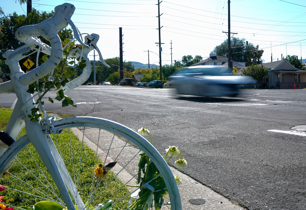 (Chris Samuels | The Salt Lake Tribune) Cars pass by a "ghost bike" memorial on 800 South in Salt Lake City, Thursday, Aug. 27, 2026, for a cyclist killed in a crash on Aug. 25.