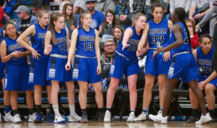 (Leah Hogsten  |  The Salt Lake Tribune)  Bingham's bench welcomes Bingham's Shanyce Makuei (20) as she leaves the game during the remaining minute of the game. Fremont defeated Bingham 61-47 to win the 6A High School Girls' Basketball Tournament title at SLCC in Taylorsville,Saturday, Feb. 24, 2018. 