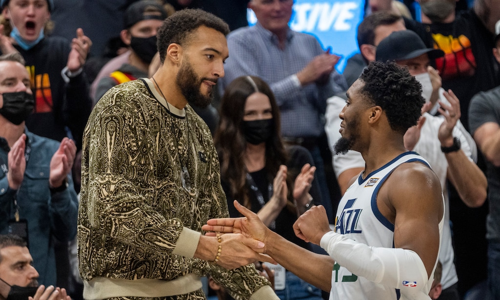 (Rick Egan | The Salt Lake Tribune) Utah Jazz center Rudy Gobert (27) greets Utah Jazz guard Donovan Mitchell (45) leaves the game with the Jazz leading by 26 points, with 5:44 left in the clock, in NBA action between the Utah Jazz and the Golden State Warriors, at Vivint Arena, on Wednesday, Feb. 9, 2022.