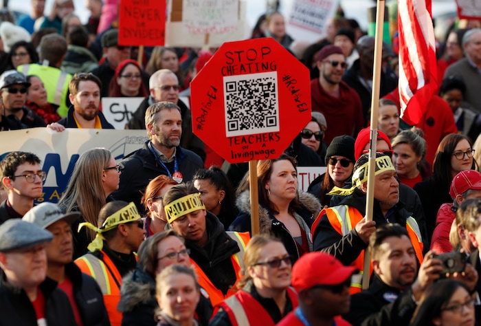 FILE - In this Jan. 30, 2019, file photo, Denver Public Schools teachers rally outside the State Capitol in Denver. Denver teachers are planning to strike Monday, Feb. 11, 2019 after failed negotiations with the school district over base pay. (AP Photo/David Zalubowski, File)