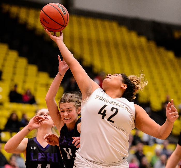(Trent Nelson | The Salt Lake Tribune)
Lehi vs. Desert Hills, 4A State high school basketball tournament at Utah Valley University in Orem, Thursday March 1, 2018. Desert Hills's Jessica Bills (42) pulls in a rebound over Lehi's Samantha Lewis (11).