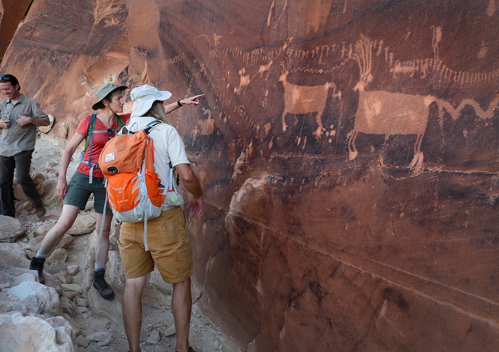 Scott Sommerdorf   |  The Salt Lake Tribune  

Then-Interior Secretary Sally Jewell talks with Vaughn Hadenfeldt about ancient petroglyphs - some of which have been vandalized -  near Comb Ridge, Saturday, July 15, 2016.