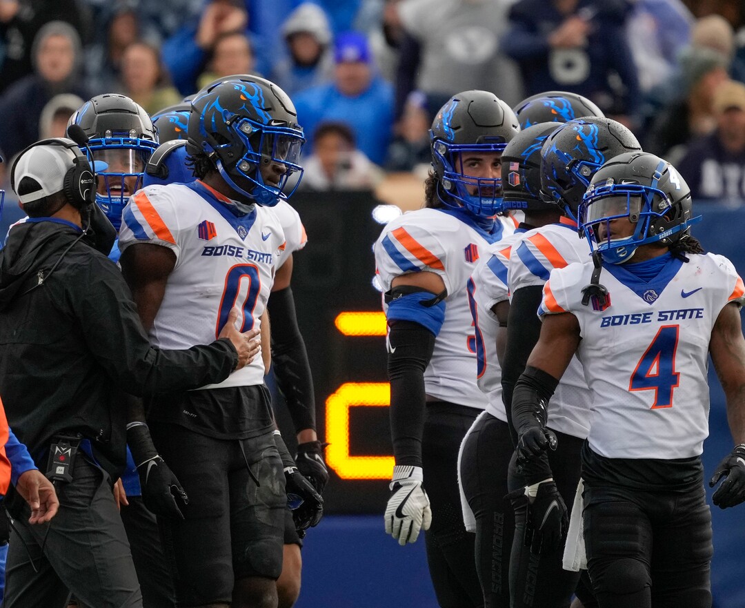 (Leah Hogsten | The Salt Lake Tribune) Boise State Broncos safety JL Skinner (0) is given a pep talk by teammates after he was ejected from the game for targeting as No. 10 Brigham Young University hosts Boise State at LaVell Edwards Stadium, Oct. 9, 2021.