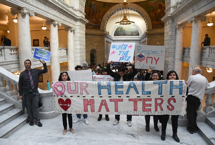 (Francisco Kjolseth  |  The Salt Lake Tribune)  A group faces the House chambers at the Utah Capitolon Monday, Jan, 28, 2019, on the first day of the Legislative session to rally in support of protecting Proposition 3, the Medicaid Expansion law recently passed by voters.