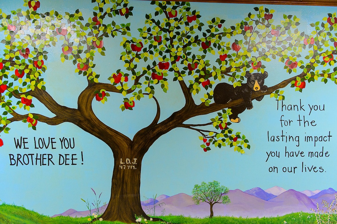 (Trent Nelson | The Salt Lake Tribune)  A mural at Pines Academy in Pinesdale, Mont., dedicated to Dee Jessop who spent 47 years as principal of the school. Each leaf has the name of a student he taught.