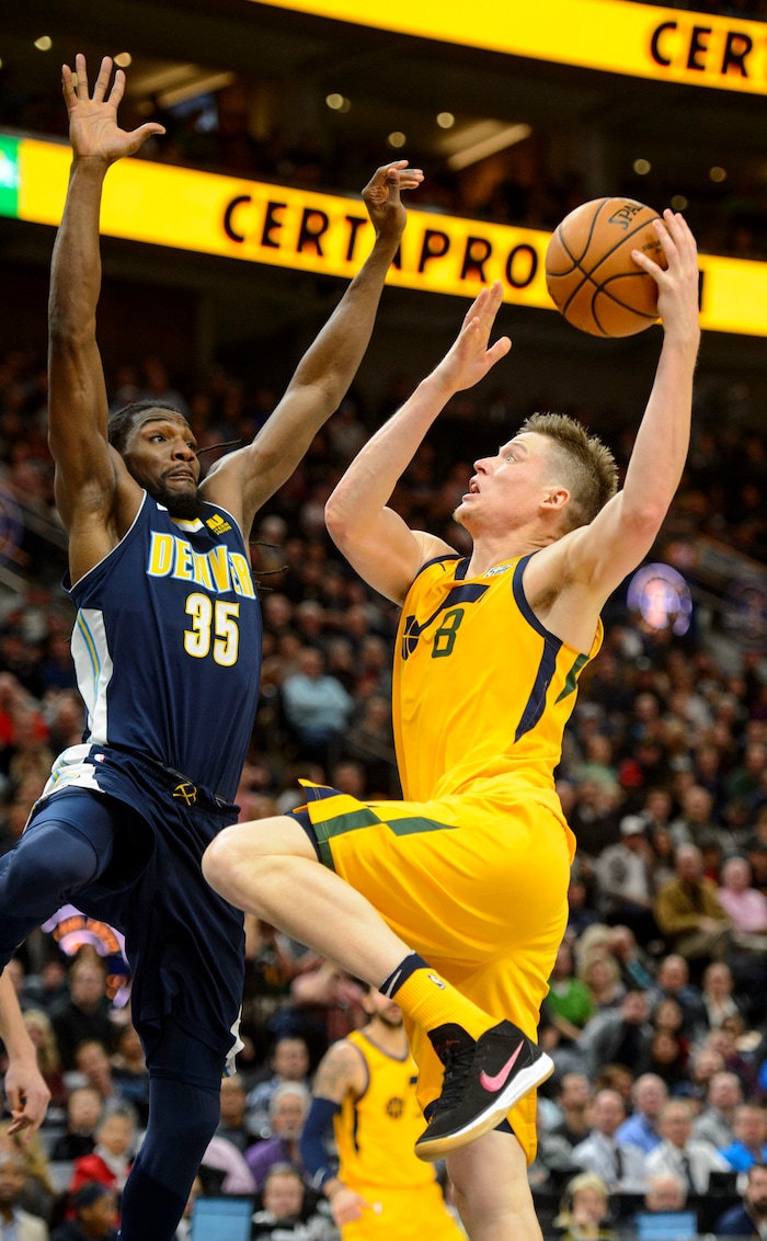 (Steve Griffin  |  The Salt Lake Tribune) Utah Jazz forward Jonas Jerebko (8) shoots over Denver Nuggets forward Kenneth Faried (35) during the Utah Jazz versus Denver Nuggets NBA basketball game at Vivint Smart Home Arena  in Salt Lake City Tuesday November 28, 2017.
