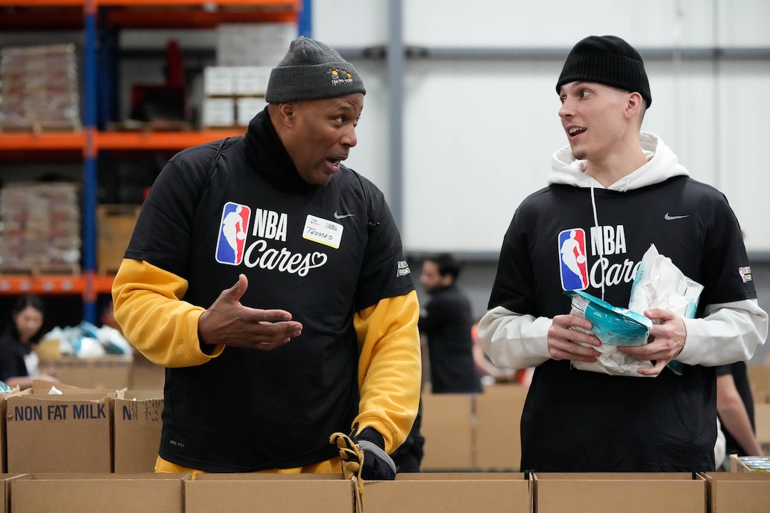 (Francisco Kjolseth | The Salt Lake Tribune) Thomas Vines, left, speaks with basketball player Tyler Herro of the Miami Heat as they join hundreds of volunteers for a hands-on service projects focused on alleviating food insecurity during the NBA Cares Day of Service in Salt Lake City on Feb. 17, 2023.