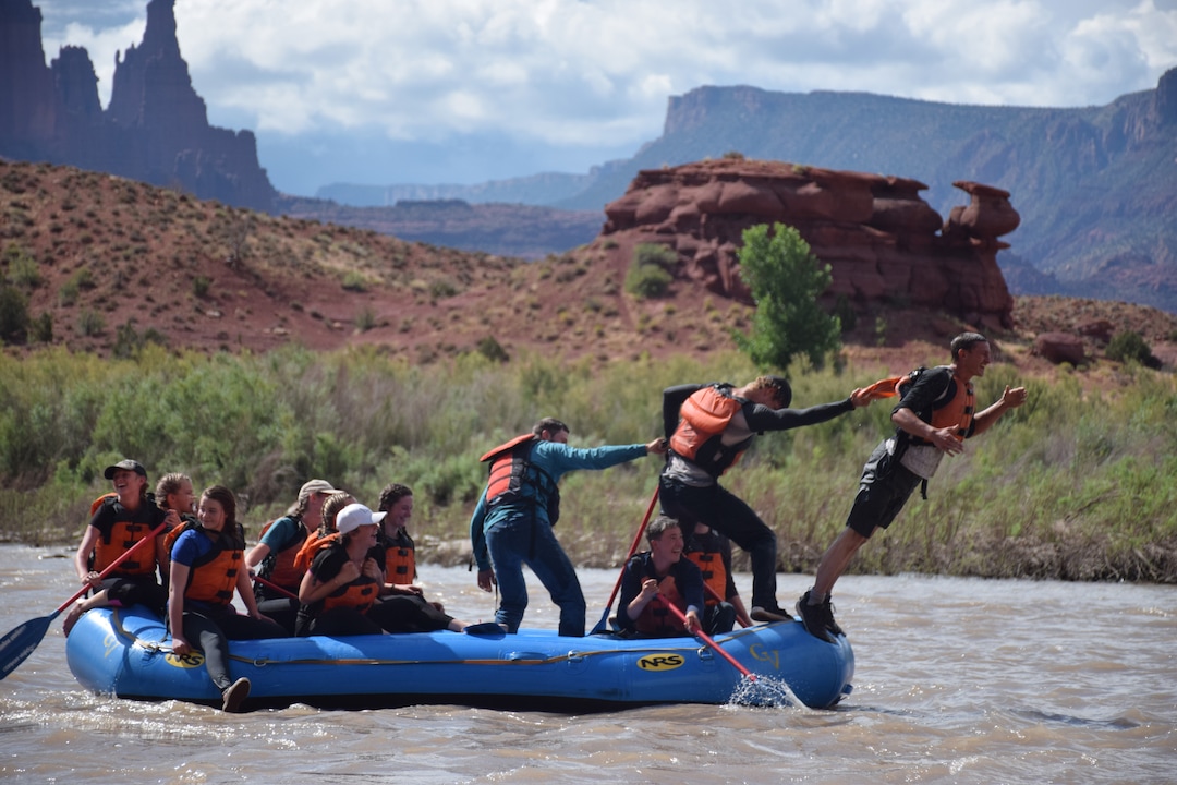 (Shannon Mullane for High Country News) Many rally-goers spent a July 27, 2019, rafting trip throwing each other in the water.