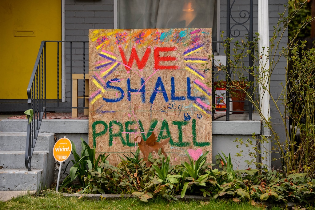 (Trent Nelson  |  The Salt Lake Tribune) A sign in the front yard of a Salt Lake City home reads "We shall prevail," on Monday, March 30, 2020.