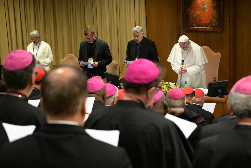 (Vincenzo Pinto/Pool Photo via AP) Pope Francis, right, prays at the opening of a sex abuse prevention summit, at the Vatican, Thursday, Feb. 21, 2019. The gathering of church leaders from around the globe is taking place amid intense scrutiny of the Catholic Church's record after new allegations of abuse and cover-up last year sparked a credibility crisis for the hierarchy.